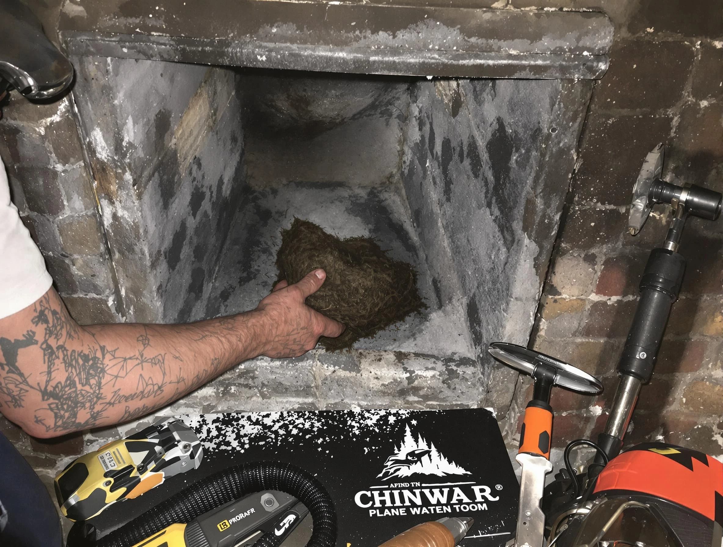 Pinson Chimney Sweep safely removing debris and screening chimney in Pinson, AL